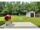 Spacious backyard features a playset, shed, lush lawn and grilling area perfect for outdoor entertaining at 1209 Polk Xing, Mcdonough, GA 30252