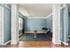Home gym in the basement featuring rubber flooring, workout equipment, and decorative columns at 1209 Polk Xing, Mcdonough, GA 30252