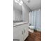 Bathroom featuring granite vanity, updated lighting, and a shower/tub combo at 1209 Polk Xing, Mcdonough, GA 30252