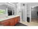 A bathroom featuring double vanity sinks, a mirror, and an entrance to a walk-in closet at 1209 Polk Xing, Mcdonough, GA 30252