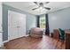 Bedroom features modern finishes, natural light, and hard wood floors at 1209 Polk Xing, Mcdonough, GA 30252