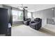 Upstairs bonus room with cozy chairs and a ceiling fan for relaxing at 1209 Polk Xing, Mcdonough, GA 30252