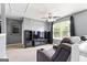 Bright bonus room with a ceiling fan and a recliner with built-in cup holders at 1209 Polk Xing, Mcdonough, GA 30252
