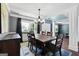 Dining room showcasing a large table, chairs, and an elegant chandelier, perfect for gatherings at 1209 Polk Xing, Mcdonough, GA 30252