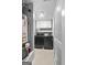 The laundry room features a washer, dryer, water heater, and cabinetry for storage at 1209 Polk Xing, Mcdonough, GA 30252