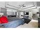 Spacious bedroom with gray walls, tray ceilings, ceiling fan, and modern furniture creates a relaxing retreat at 1209 Polk Xing, Mcdonough, GA 30252