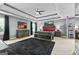 The spacious bedroom features a tray ceiling, ceiling fan, and elegant decor at 1209 Polk Xing, Mcdonough, GA 30252