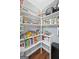 Walk-in pantry featuring white shelves and organized food storage at 1209 Polk Xing, Mcdonough, GA 30252
