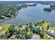 Aerial view highlighting the lakeside property, lush greenery, and surrounding neighborhood on the lake at 2775 Club Valley Ct, Jonesboro, GA 30236