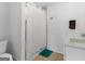 Bright bathroom featuring a shower, toilet, vanity with sink, towel rack, and hardwood floors at 2775 Club Valley Ct, Jonesboro, GA 30236
