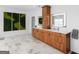 Bathroom with wooden cabinets, a double sink vanity, and stylish moss art for a spa-like ambiance at 2775 Club Valley Ct, Jonesboro, GA 30236