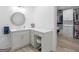 Elegant bathroom vanity features a round mirror, ample counter space, and a comfortable stool at 2775 Club Valley Ct, Jonesboro, GA 30236