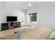 Bedroom featuring a large window with views of the landscape and modern interior design at 2775 Club Valley Ct, Jonesboro, GA 30236