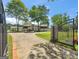 Long private driveway leading to a grand home, framed by an ornate security gate at 2775 Club Valley Ct, Jonesboro, GA 30236