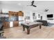 Entertaining game room featuring a pool table, wet bar, and views into an adjacent seating area with a fireplace at 2775 Club Valley Ct, Jonesboro, GA 30236
