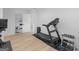 Fully equipped home gym with treadmill, weights, and ample storage space at 2775 Club Valley Ct, Jonesboro, GA 30236