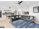 Spacious living area featuring a large sofa, a pool table, and an bar area with stools for a lively atmosphere at 2775 Club Valley Ct, Jonesboro, GA 30236