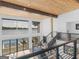 Living room with a view of the lake and an exit to the outdoor deck and pool area at 2775 Club Valley Ct, Jonesboro, GA 30236
