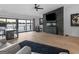 Living room boasts expansive windows, lake view, stone fireplace, and open layout at 2775 Club Valley Ct, Jonesboro, GA 30236