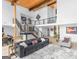 Bright, open-concept living room featuring high ceilings, a modern staircase, and stylish decor at 2775 Club Valley Ct, Jonesboro, GA 30236