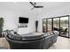 Modern living room with a sleek fireplace, comfortable seating, and access to outdoor lake views through sliding doors at 2775 Club Valley Ct, Jonesboro, GA 30236