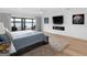 Inviting bedroom with a comfortable bed, fireplace, and picturesque lake views at 2775 Club Valley Ct, Jonesboro, GA 30236