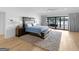 Serene bedroom with water view, ceiling fan, and access to a private balcony at 2775 Club Valley Ct, Jonesboro, GA 30236