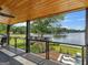 Covered outdoor deck with lake views and access to the waterfront and dock at 2775 Club Valley Ct, Jonesboro, GA 30236