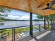 Outdoor deck overlooking pool, lake, and lush landscaping for perfect relaxation at 2775 Club Valley Ct, Jonesboro, GA 30236