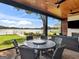 An inviting outdoor patio features comfortable seating and beautiful lake views for relaxing and entertaining at 2775 Club Valley Ct, Jonesboro, GA 30236