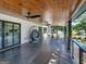 Covered patio featuring a hanging chair, ceiling fan, and lake view at 2775 Club Valley Ct, Jonesboro, GA 30236