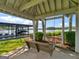 Covered porch with a hanging swing offering scenic lake views and glimpses of a covered boat dock at 2775 Club Valley Ct, Jonesboro, GA 30236