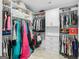 Spacious walk-in closet with custom shelving, hanging rods, and ample storage for organization at 2775 Club Valley Ct, Jonesboro, GA 30236