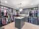Well-organized walk-in closet with shelving, central island, and stylish layout for optimal storage at 2775 Club Valley Ct, Jonesboro, GA 30236