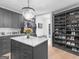 Large walk-in closet with custom shelving, central island, and elegant lighting for organized storage at 2775 Club Valley Ct, Jonesboro, GA 30236