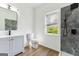 Bathroom with stylish vanity, sleek black fixtures, and a walk-in shower at 437 Collier Ridge Nw Dr, Atlanta, GA 30318