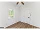 Bedroom showcasing hardwood floors, a ceiling fan, a window, and closet at 437 Collier Ridge Nw Dr, Atlanta, GA 30318