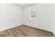 Minimalist bedroom design with hardwood flooring and a view to the outdoors at 437 Collier Ridge Nw Dr, Atlanta, GA 30318