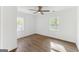 Spacious bedroom with hardwood floors, natural light, and a ceiling fan at 437 Collier Ridge Nw Dr, Atlanta, GA 30318