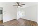 Bright bedroom featuring a ceiling fan, natural light, and wood-look flooring at 437 Collier Ridge Nw Dr, Atlanta, GA 30318