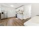 Bright kitchen featuring white cabinets, stainless steel appliances, and hardwood flooring at 437 Collier Ridge Nw Dr, Atlanta, GA 30318