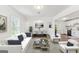 Bright, open-concept living space with modern decor and seamless flow between living, dining, and kitchen areas at 437 Collier Ridge Nw Dr, Atlanta, GA 30318