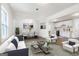 Open-concept living space featuring white walls, stylish decor, and views into the dining area and kitchen at 437 Collier Ridge Nw Dr, Atlanta, GA 30318