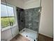 Bathroom featuring glass enclosed walk-in shower and modern fixtures at 437 Collier Ridge Nw Dr, Atlanta, GA 30318