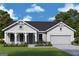 Charming single-story home with a craftsman-style facade, attached garage and nicely landscaped front yard at 580 Barnfield Way, Dallas, GA 30157