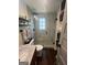 Bathroom featuring a glass shower with tile and a granite vanity with shelves and drawers at 155 Central Ave, Fayetteville, GA 30214