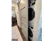 New, stackable washer and dryer tucked into the laundry closet at 155 Central Ave, Fayetteville, GA 30214