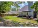 Spacious backyard featuring a well-maintained lawn and a lovely patio area, perfect for outdoor living at 3511 Cherry Blossom Ct, Loganville, GA 30052