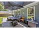 Outdoor patio with ample seating and a large umbrella, creating a comfortable and inviting space for relaxation at 3511 Cherry Blossom Ct, Loganville, GA 30052