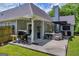 Outdoor patio featuring an outdoor grill and seating, perfect for summer gatherings at 3511 Cherry Blossom Ct, Loganville, GA 30052